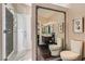 Elegant bathroom with a large mirror, shower, and toilet at 5205 Sandy Cactus Ln, Las Vegas, NV 89149