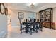 Elegant dining room with a formal table setting and a large china cabinet at 5205 Sandy Cactus Ln, Las Vegas, NV 89149