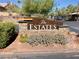 Community entrance sign for The Estates, showcasing landscaping and architecture at 5205 Sandy Cactus Ln, Las Vegas, NV 89149