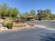 Gated community entrance with signage and landscaping at 5205 Sandy Cactus Ln, Las Vegas, NV 89149