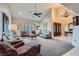 Bright and airy living room with high ceilings, hardwood floors, and ample seating at 5205 Sandy Cactus Ln, Las Vegas, NV 89149