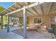 Relaxing patio with a hammock under a pergola at 5205 Sandy Cactus Ln, Las Vegas, NV 89149