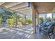 Relaxing covered patio with seating area and fountain, perfect for outdoor living at 5205 Sandy Cactus Ln, Las Vegas, NV 89149