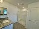 Bright bathroom with granite top sink and step-in shower at 6680 Nimbus Ave # Lot 20, Las Vegas, NV 89130