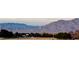 Wide shot of mountains in the distance and foreground desert landscape at 6680 Nimbus Ave # Lot 20, Las Vegas, NV 89130