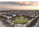 Aerial view of a residential community with a park and playground at 11712 Emerald Lake Ave, Las Vegas, NV 89138