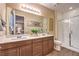 Modern bathroom with double vanity and a large walk-in shower at 11712 Emerald Lake Ave, Las Vegas, NV 89138