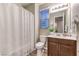 Modern bathroom with a vanity and shower/tub combo at 11712 Emerald Lake Ave, Las Vegas, NV 89138