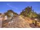 Entrance to community park with brick pathway and lighting at 11712 Emerald Lake Ave, Las Vegas, NV 89138