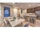 Modern dining room with marble top table and kitchen views at 11712 Emerald Lake Ave, Las Vegas, NV 89138