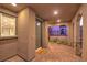 Covered entryway with brick pavers and a modern front door at 11712 Emerald Lake Ave, Las Vegas, NV 89138