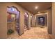 Covered entryway with brick pavers and arched columns at 11712 Emerald Lake Ave, Las Vegas, NV 89138