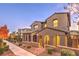 Two-story home with modern facade, brick accents, and gated entry at 11712 Emerald Lake Ave, Las Vegas, NV 89138