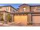 Attached garage with double doors and brick paver driveway at 11712 Emerald Lake Ave, Las Vegas, NV 89138