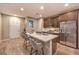 Modern kitchen with island, stainless steel appliances, and white countertops at 11712 Emerald Lake Ave, Las Vegas, NV 89138