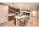 Open concept kitchen with island and modern cabinetry at 11712 Emerald Lake Ave, Las Vegas, NV 89138