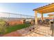 Backyard with patio, grill, and artificial turf at 2815 Donatello Manor Pl, Henderson, NV 89044