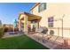 Backyard with patio, grill, and artificial turf at 2815 Donatello Manor Pl, Henderson, NV 89044