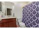 Clean bathroom with a shower/tub combo and dark-wood vanity at 2815 Donatello Manor Pl, Henderson, NV 89044