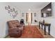 Relaxing bonus room with brown leather recliners and a large TV at 2815 Donatello Manor Pl, Henderson, NV 89044