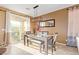 Dining area with a glass-top table and seating for four at 2815 Donatello Manor Pl, Henderson, NV 89044