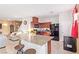 Kitchen with granite island, dark wood cabinets, and black appliances at 2815 Donatello Manor Pl, Henderson, NV 89044