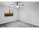 Relaxing bedroom featuring plush carpet, a single window, and ceiling fan for optimal comfort and serene atmosphere at 3531 W Arby Ave, Las Vegas, NV 89118