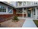 Inviting front porch area featuring a well-maintained pebble garden, brick accents, and an elegant front door at 3531 W Arby Ave, Las Vegas, NV 89118