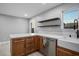 Updated kitchen featuring a farmhouse sink, stainless steel appliances, and quartz countertops at 3531 W Arby Ave, Las Vegas, NV 89118
