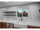 Modern kitchen features quartz countertops, stainless steel dishwasher, and a farmhouse sink at 3531 W Arby Ave, Las Vegas, NV 89118