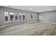 Bright living room boasts new floors, large windows, and neutral paint, ready for your personal touch at 3531 W Arby Ave, Las Vegas, NV 89118
