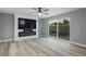 Living room features a built-in entertainment center, electric fireplace, and sliding glass doors to the backyard at 3531 W Arby Ave, Las Vegas, NV 89118