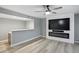 Living room with a built-in entertainment center, electric fireplace, and open floor plan at 3531 W Arby Ave, Las Vegas, NV 89118