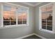 Close up view of a set of windows showcasing an orange sunset view from the interior at 3531 W Arby Ave, Las Vegas, NV 89118