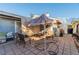 Relaxing patio area with table, chairs and shade at 2302 El Molino Cir, Las Vegas, NV 89108