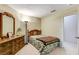 Small bedroom with wood furniture and access to a hallway at 6143 Basilone Ave, Las Vegas, NV 89122