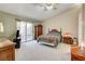 Spacious bedroom with wood furniture and access to backyard at 6143 Basilone Ave, Las Vegas, NV 89122