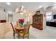 Dining room with a wooden table, chandelier, and view of the kitchen at 6143 Basilone Ave, Las Vegas, NV 89122