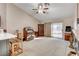 Living room with fireplace, sliding glass door, and ceiling fan at 6143 Basilone Ave, Las Vegas, NV 89122