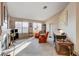 Living room with fireplace, two armchairs, and a writing desk at 6143 Basilone Ave, Las Vegas, NV 89122