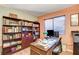 Home office with wood desk and built-in shelving at 6143 Basilone Ave, Las Vegas, NV 89122