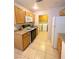 Galley kitchen with wood cabinets and appliances at 2760 Stargate St, Las Vegas, NV 89108