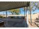 Backyard patio with covered seating area and hot tub at 445 Wright Way, Henderson, NV 89015