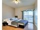 Main bedroom with wood floors and patio access at 445 Wright Way, Henderson, NV 89015