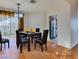 Bright dining room with hardwood floors and a chandelier at 445 Wright Way, Henderson, NV 89015