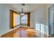 Bright dining room featuring hardwood floors and large windows at 445 Wright Way, Henderson, NV 89015