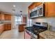 Kitchen with granite countertops and stainless steel appliances at 445 Wright Way, Henderson, NV 89015