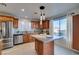 Modern kitchen featuring granite island and stainless steel appliances at 445 Wright Way, Henderson, NV 89015