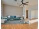 Virtually staged living room, featuring hardwood floors and ceiling fan at 445 Wright Way, Henderson, NV 89015