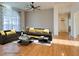 Virtually staged living room with hardwood floors and modern furniture at 445 Wright Way, Henderson, NV 89015